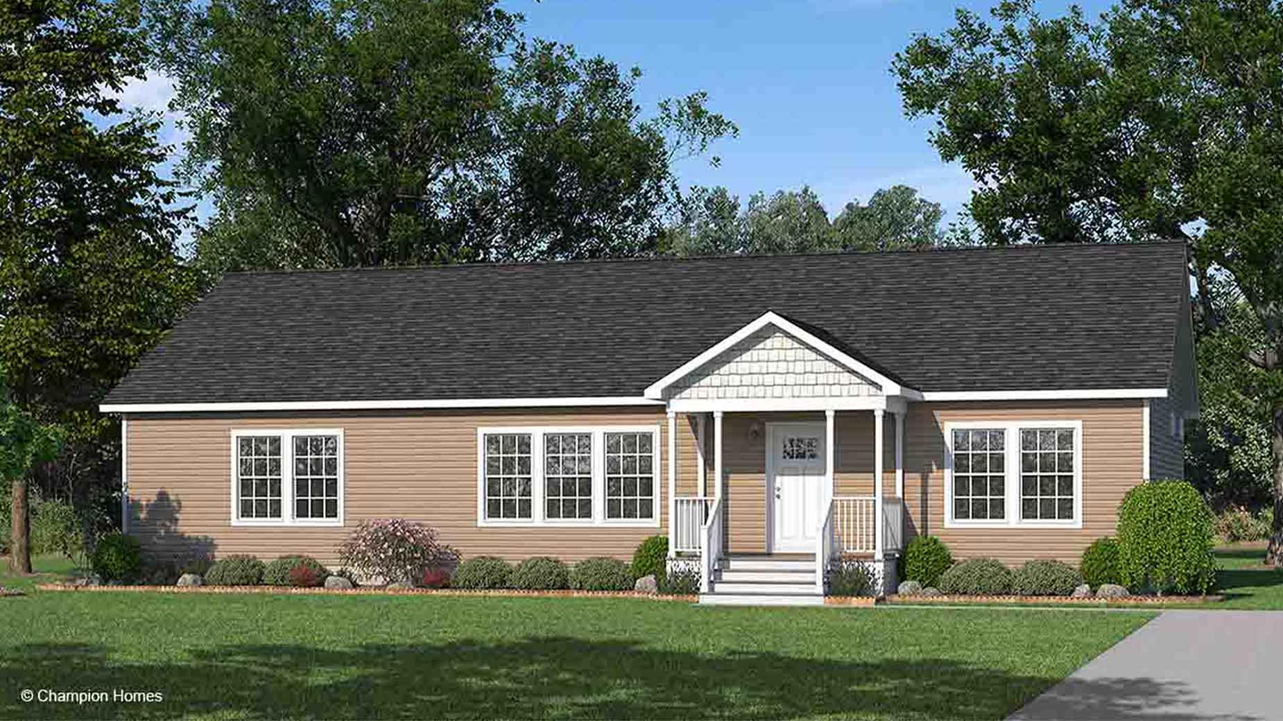 Single-story tan modular home rendering with white trim, a front porch, and a landscaped yard, surrounded by trees.
