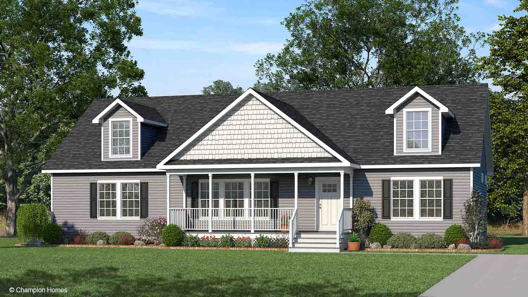 Gray ranch-style modular home rendering featuring dormer windows, a welcoming front porch, and a landscaped yard on a sunny day.