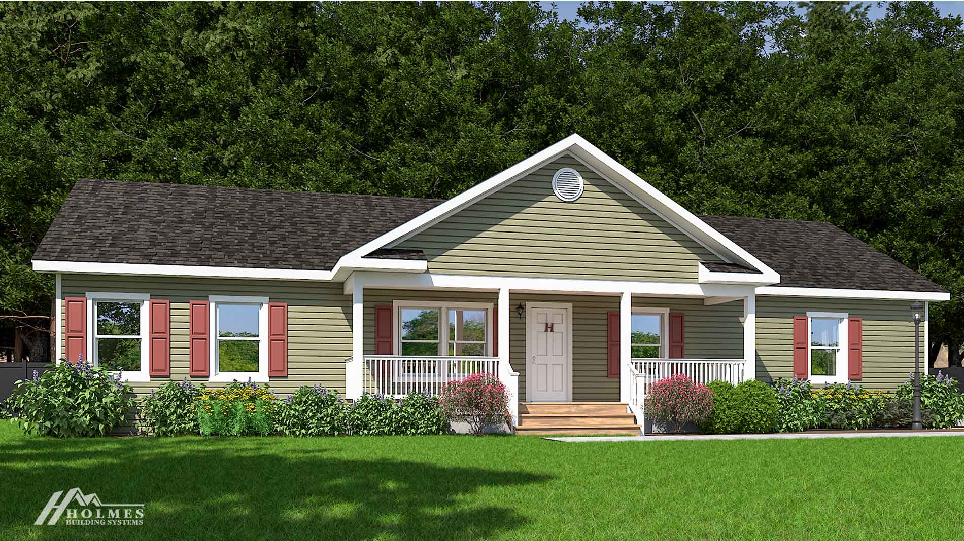 Single-story modular home with green siding, white trim, a welcoming front porch, and colorful flowers brightening the yard.