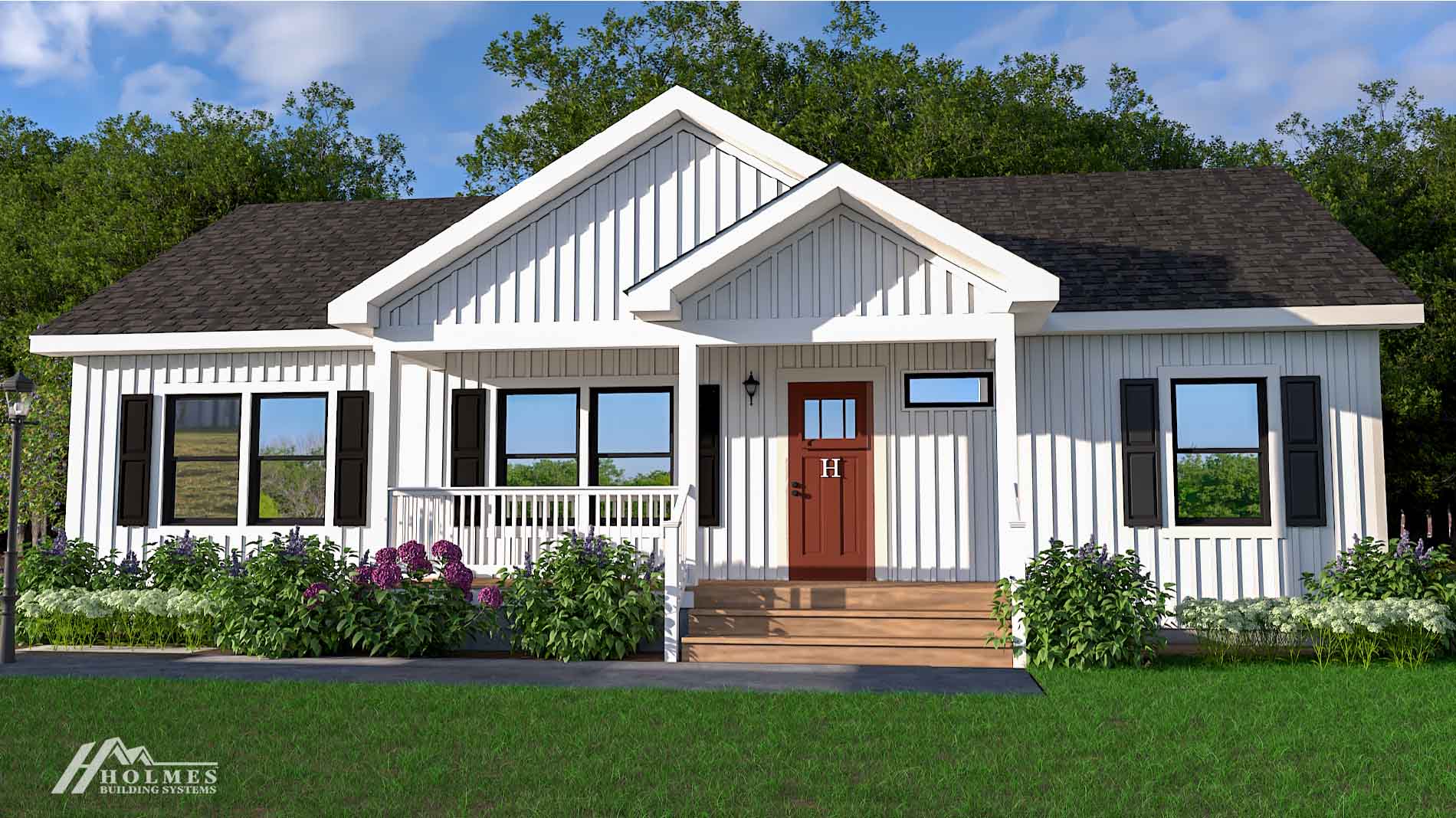 Charming white farmhouse-style modular home with a front porch, dark roof, and red door, surrounded by green bushes and trees.